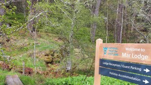 A wooden sign with directions to Mar Lodge, including Lodge Reception and Holiday Accommodation. - Paye House - Cromarty (Cromarty)