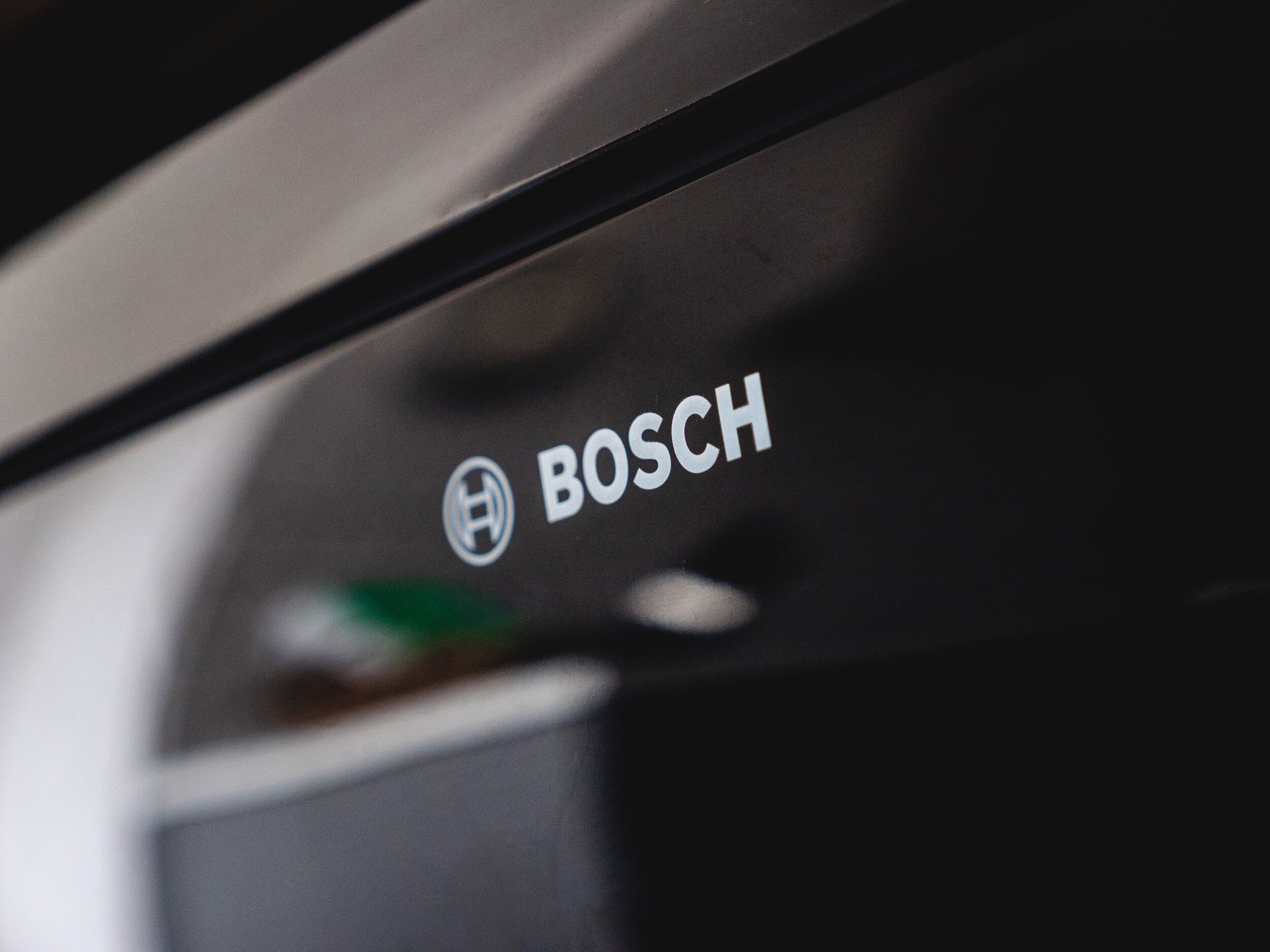 A close-up of a black object with the word "BOSCH" and a logo.