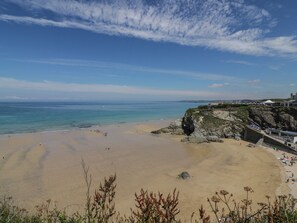 A beach with clear skies and calm waters. - Penn-an-vownder (Newquay)