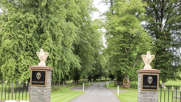A pathway leading to Stobo Castle with stone pillars and a crest. - Torview House (Peebles)