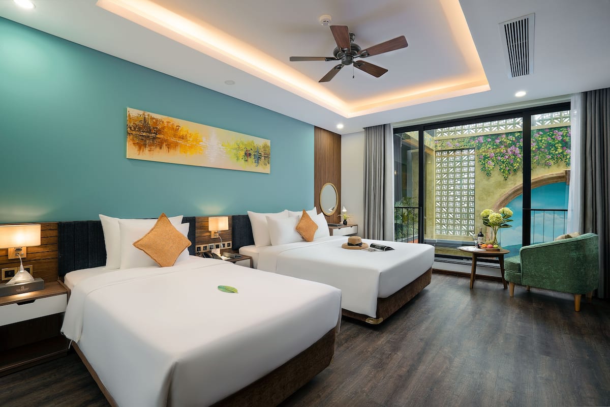 Deluxe Triple Room with Pool View | Minibar, individually decorated, individually furnished, desk