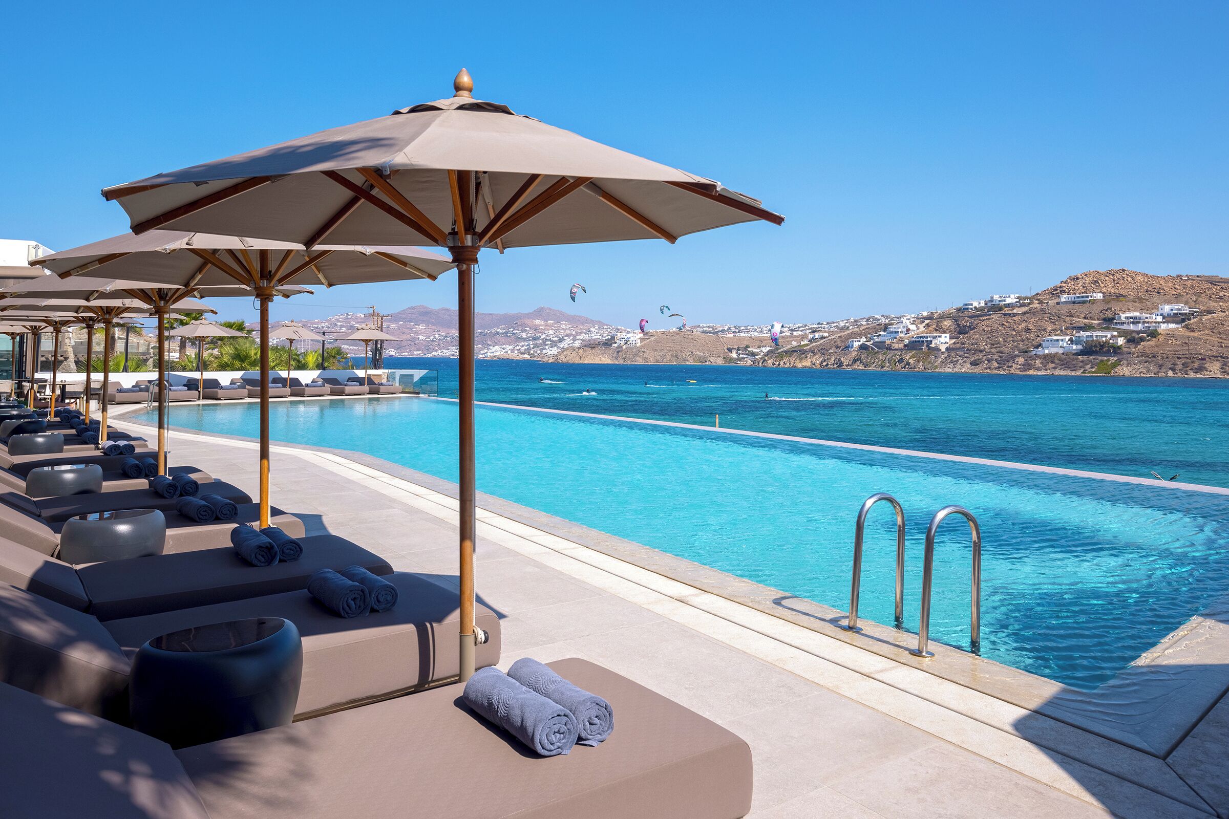 seasonal outdoor pool, pool umbrellas, pool loungers