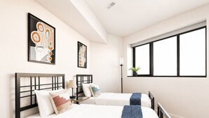 A hotel room with two beds, a large window, and artwork on the walls. - Upscale 3BR Penthouse by CozySuites (Indianapolis)