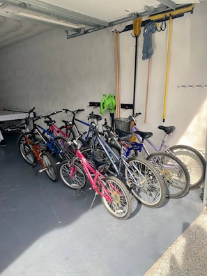 A garage with bicycles parked inside.