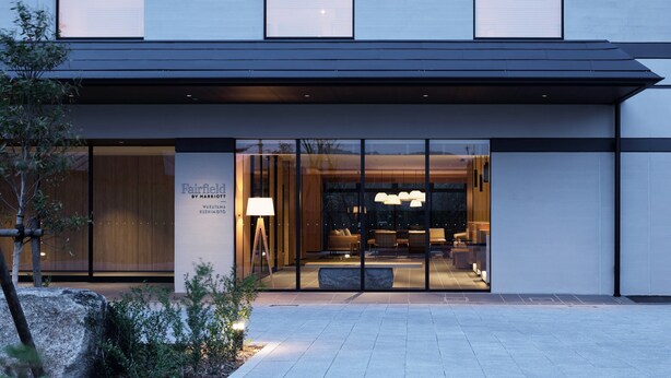 A modern hotel entrance with large glass doors, a well-lit interior, and a visible seating area. - Fairfield by Marriott Wakayama Kushimoto (Kushimoto)