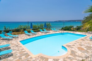 Seasonal outdoor pool, pool umbrellas, pool loungers