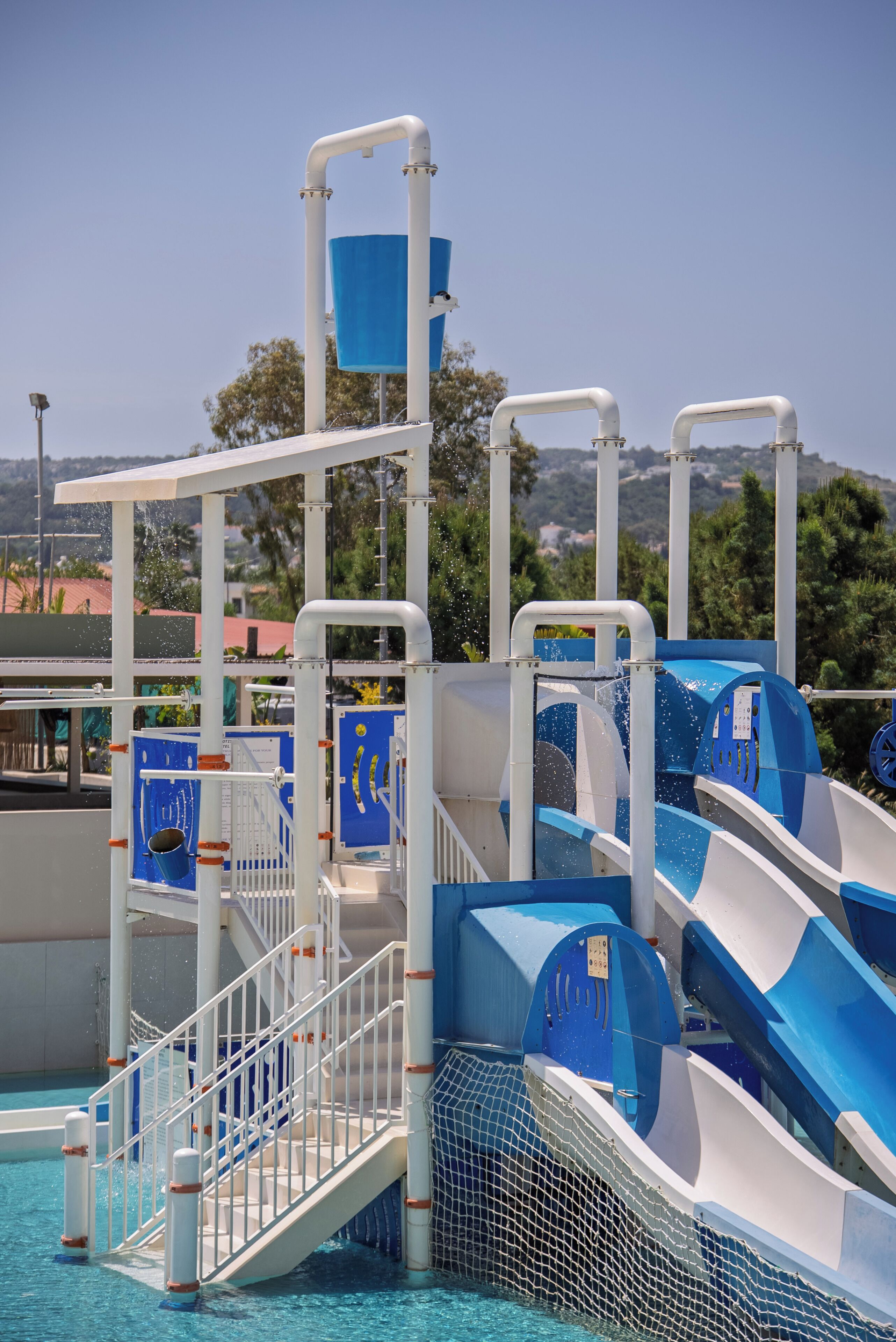 A water park with multiple slides and a pool area.