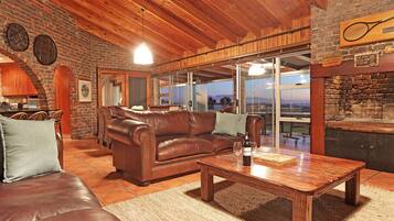 Deluxe House | Living area | Flat-screen TV