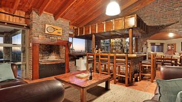 Deluxe House | Living area | Flat-screen TV