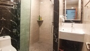 A bathroom with a toilet, a shower, and a sink. - Good 9 Hotel, Cahaya Kota Puteri (Masai)