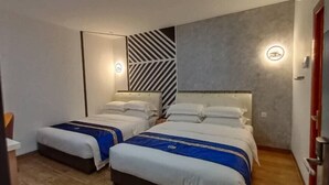 A hotel room with two beds, a modern design, and a large window. - Good 9 Hotel, Cahaya Kota Puteri (Masai)