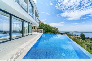 A heated pool, pool loungers - Luxury Villa Royal - modern newly built villa with views of Hvar town, the sea and the islands by MyWaycation (Hvar)