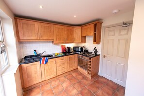 Fridge, dishwasher, cookware/dishes/utensils, dining tables