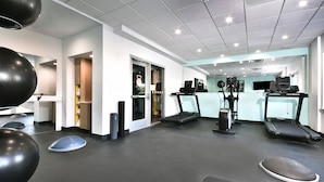 A modern gym with treadmills, exercise balls, and a weight bench. - Tru by Hilton Beckley (Beckley)
