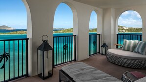 A balcony with a view of turquoise waters and a distant island. - BREATHTAKING VIEWS - RITZ CARLTON ST. THOMAS (St Thomas)