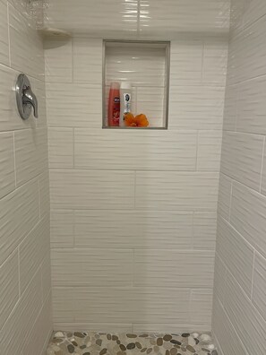 Shower, hair dryer, towels, soap