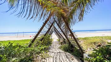 On the beach, sun loungers, beach towels