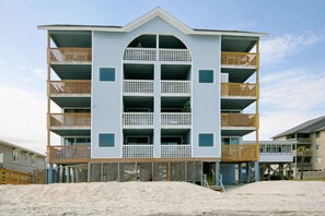 Stunning multi-story building with a central arched window and accessible balconies.