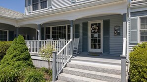 A two-story house with a porch, a welcome sign, and a mailbox. - Spacious Beach Villa - Ocean Views - 3 Minute Walk to Shore - Available All Year (Wells)