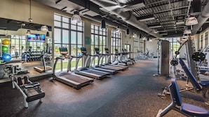 A gym with treadmills, weight machines, and exercise balls. - New Listing! Solara Resort, 8mi to Disney & 15mi to Universal - GRH438758 (Kissimmee)