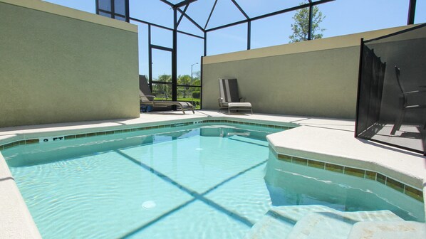A heated pool, sun loungers