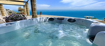Stone house with outdoor jacuzzi on the cliffs (A)