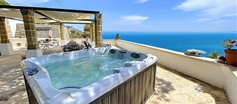 Stone house with outdoor jacuzzi on the cliffs (A)