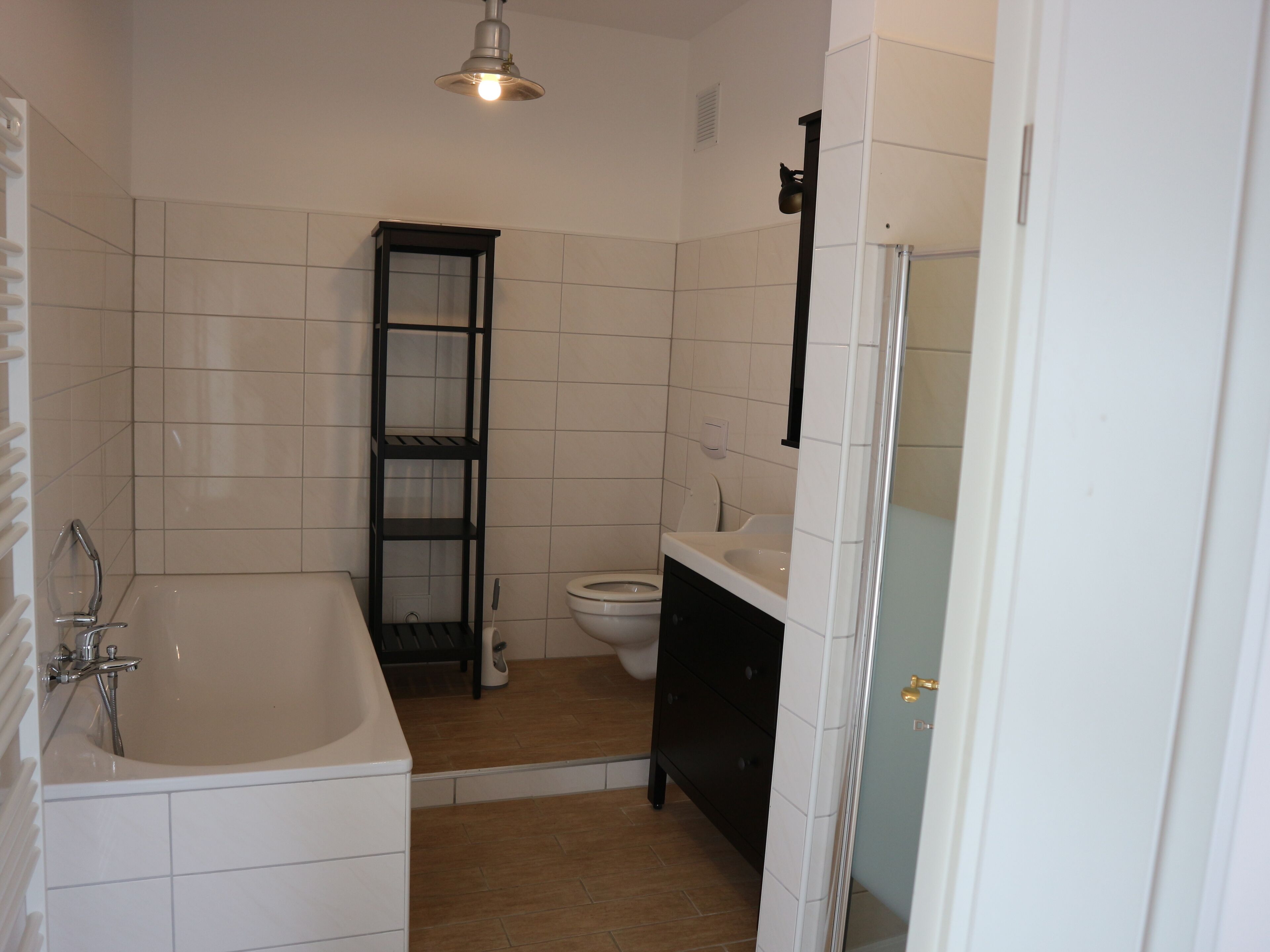 Bathtub, towels, soap, toilet paper