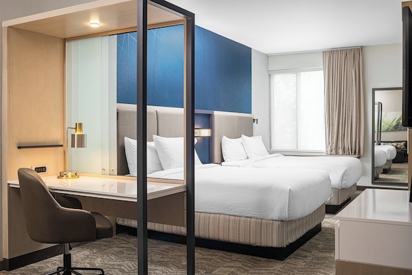 Desk, laptop workspace, iron/ironing board, free cribs/infant beds