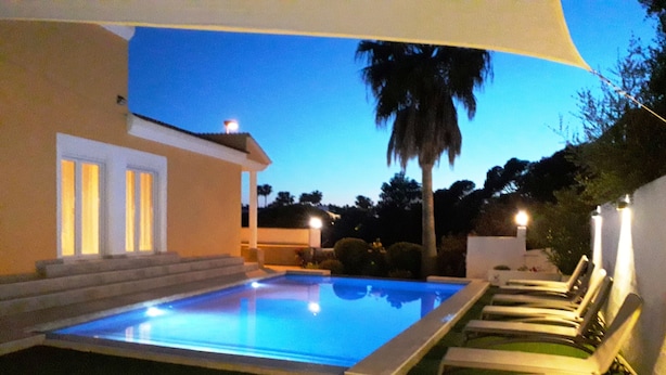 A swimming pool with lounge chairs, a staircase, and a palm tree. - PRIVATE VILLA WITH POOL VALLADA.No for rent to under 25 years old for S.Joan (ciutadella de menorca)
