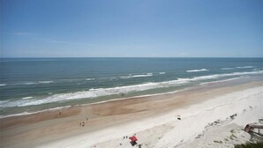 A beach with a clear sky and calm sea. - Seychelles 1405 - Daytona Beach Oceanfront Vacations, Inc (Daytona Beach Shores)