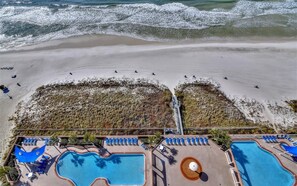 A resort with multiple swimming pools, a beach area, and a lifeguard tower. - Freshly updated, fully loaded, w/amazing gulf views from the LR & Master bdrm. Beach service included! (Panama City Beach)