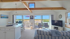 TV, books - Waterfront 2BD Cottage: RIGHT ON THE BEACH, Water View, Direct Beach Access, A/C & Exclusive Use Deck (North Truro)