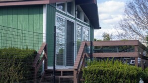 A two-story building with a green exterior and a brown roof. - Dog Lover's Chalet w/ Fenced Yard, AMAZING VIEW 10mi to Camelback/Hiking/Casino (Sciota)