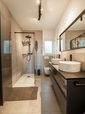 Shower, hair dryer, towels, soap