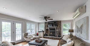 TV, fireplace, books