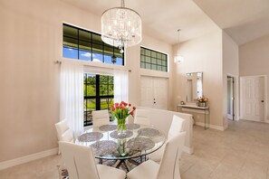 Enjoy meals in this elegant dining area with a round table and six chairs.