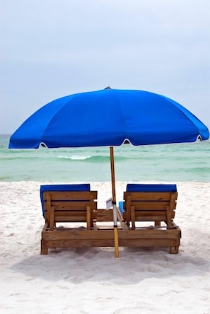 On the beach, sun loungers, beach towels