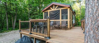 Tiny house nestled in the woods with lake view. Pets Accepted!