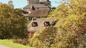 A historic building with multiple towers and a prominent central tower. - Family Retreat in Thédirac (Thedirac)