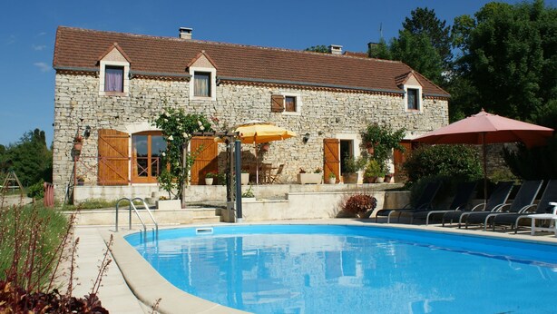 A stone building with a swimming pool, outdoor seating, and potted plants. - Family Retreat in Thédirac (Thedirac)