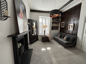 Smart TV, fireplace, books, video library