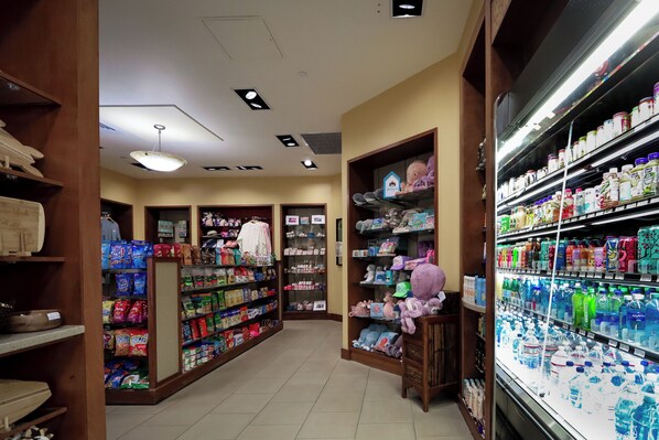A store interior with shelves stocked with snacks, beverages, and household items. - 2 bedroom Ocean View Lagoon Tower by Hilton Grand Vacations (Honolulu)