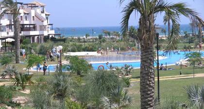Spacious 2 bed garden apartment, secure urbanisation, front line beach in Vera