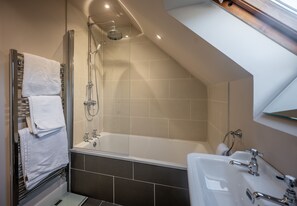 Combined shower/tub, hair dryer, towels, toilet paper