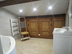 Bathtub, hair dryer, towels, soap