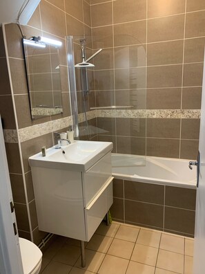Combined shower/tub, hair dryer, towels, toilet paper