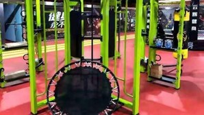 A gym with green exercise equipment and a trampoline. - Greentree Inn Changzhou Wujin Bus Station (Changzhou)