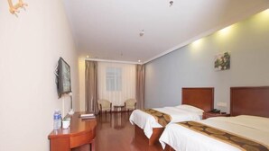 A hotel room with two beds, a desk, a chair, a TV, and a window with curtains. - Greentree Inn Changzhou Wujin Bus Station (Changzhou)