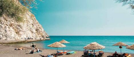 On the beach, black sand, 7 beach bars